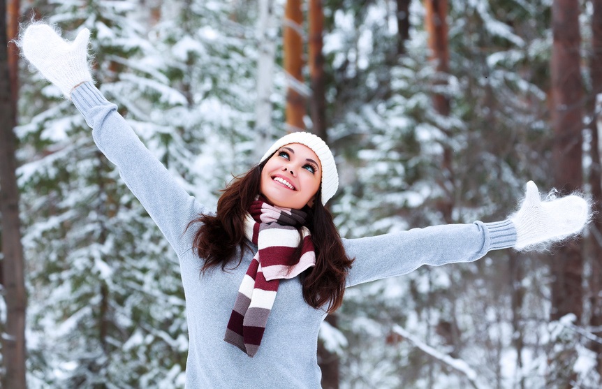 Happy woman in a winter forest